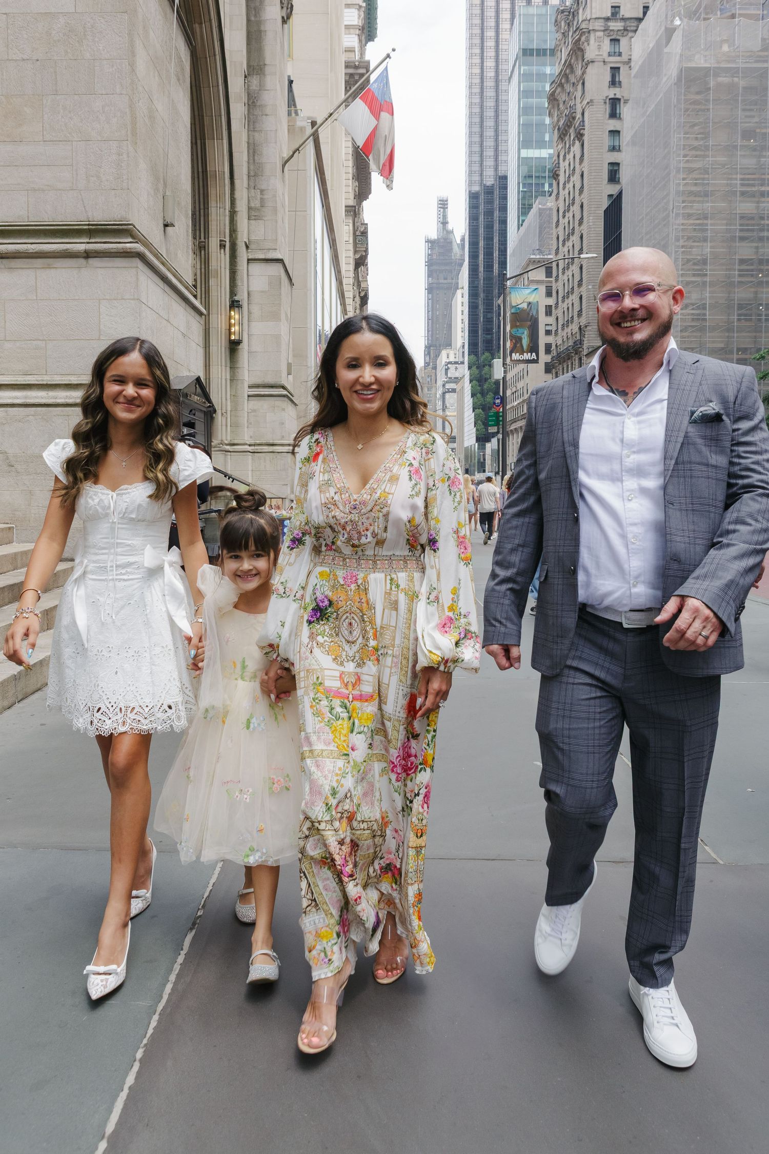 Candid family strolling down Fifth Avenue, baptism day photo by Paula Brearley