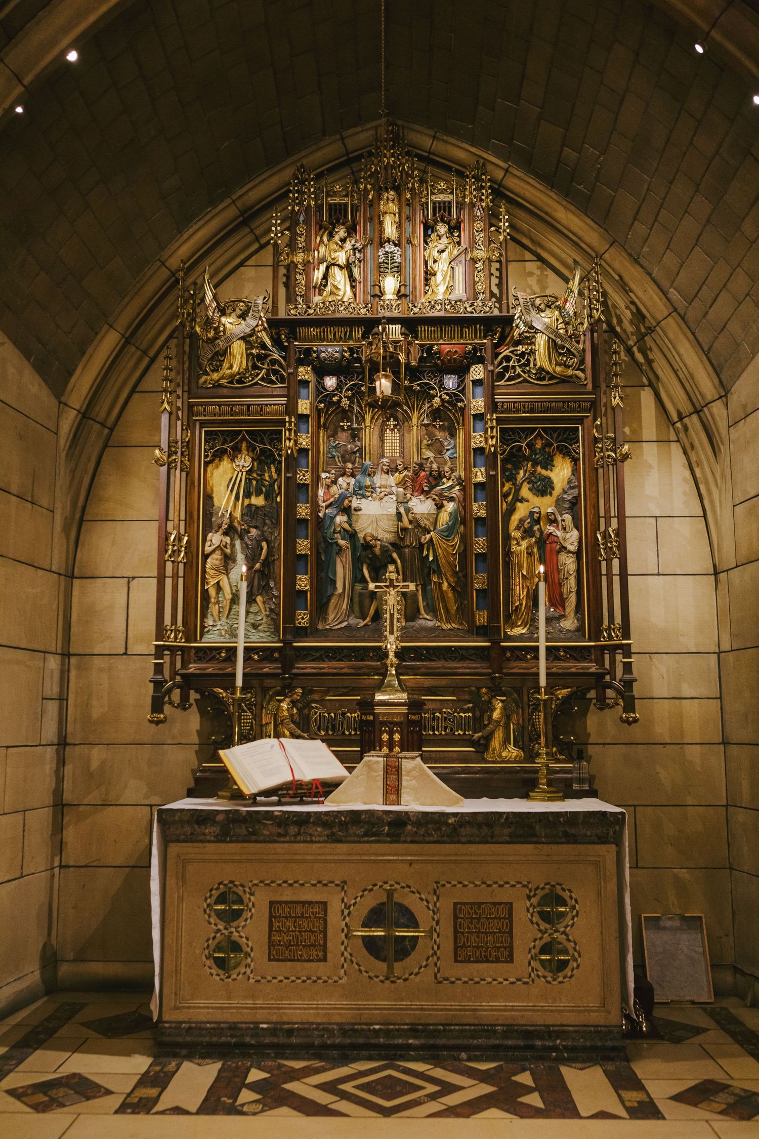 Baptismal font and cross at St. Thomas Church NYC captured by family photographer Paula Brearley