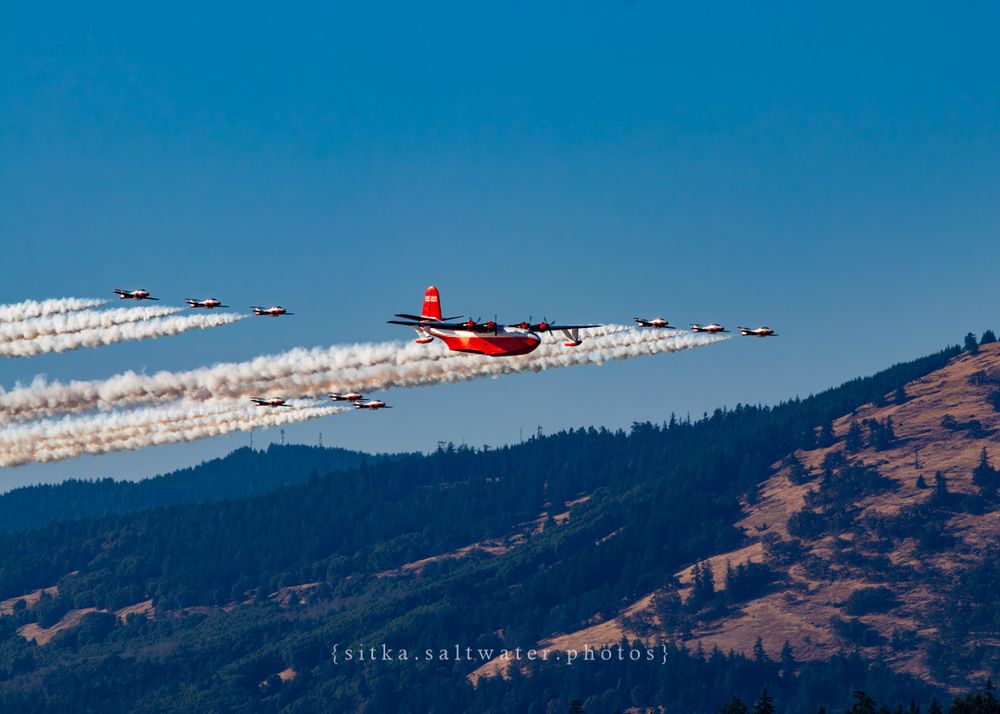 Hawaii Mars leads a CF Snowbirds formation flight over mountainous terrain.