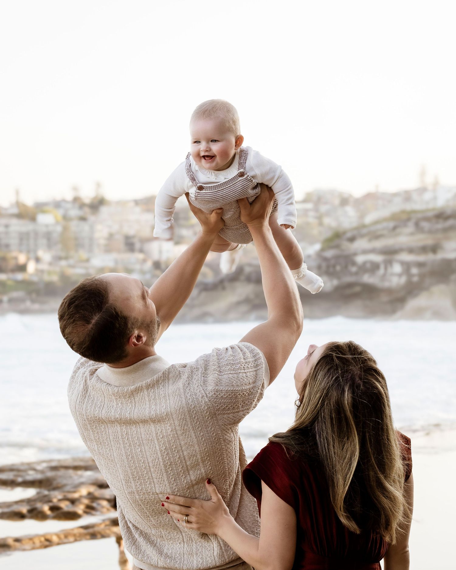 emotional family portrait by the water