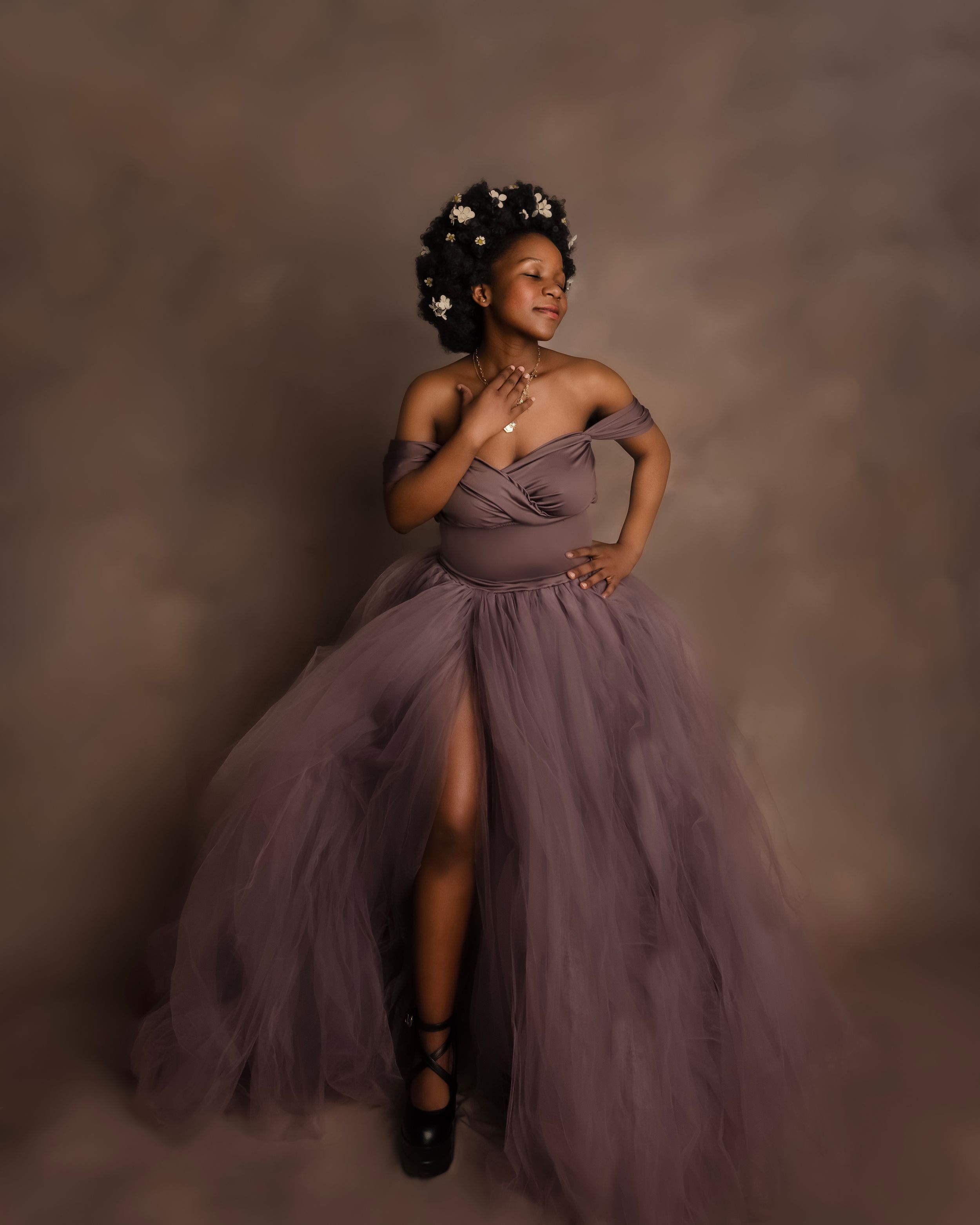 Pregnant woman in glam gown in studio maternity photography