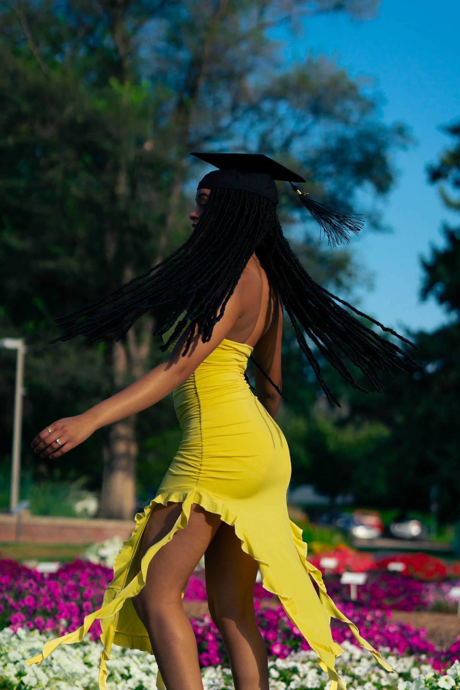 Colorado State University Graduate Celebrating Accomplishment at the CSU Gardens Captured By KamaraImages