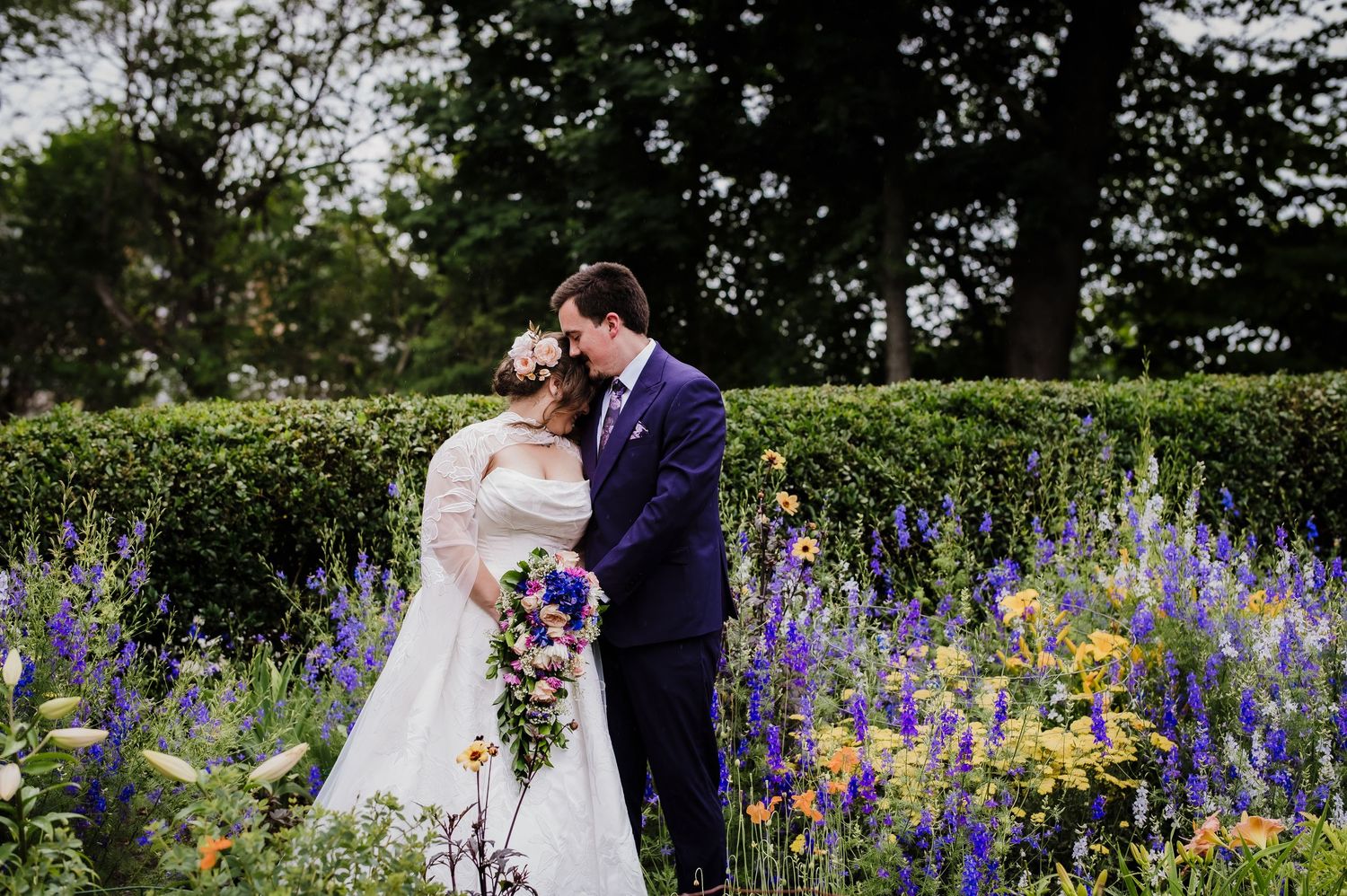 Romantic indoor wedding photos with string lights and a couple sharing intimate moments in formal attire.