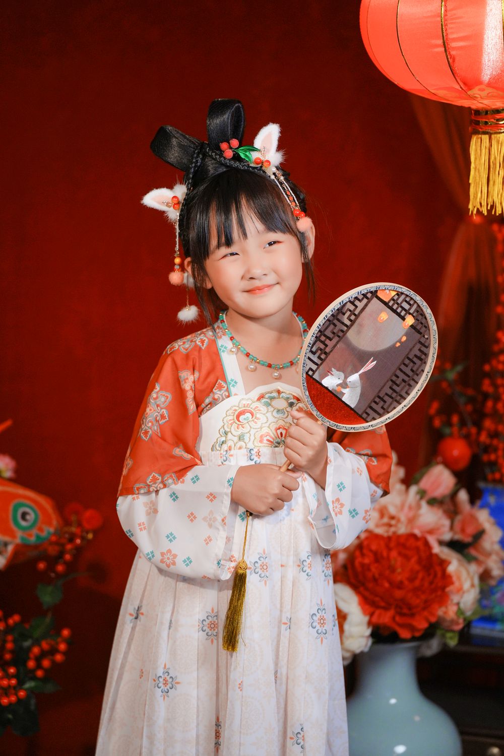 Cinematic warm-toned Tang Dynasty Hanfu portrait of a 3-generation family celebrating Lunar New Year, by Imagine Image Studio Auckland.