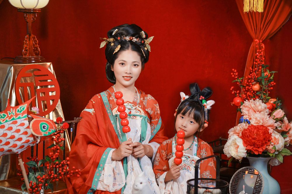 Cinematic warm-toned Tang Dynasty Hanfu portrait of a 3-generation family celebrating Lunar New Year, by Imagine Image Studio Auckland.
