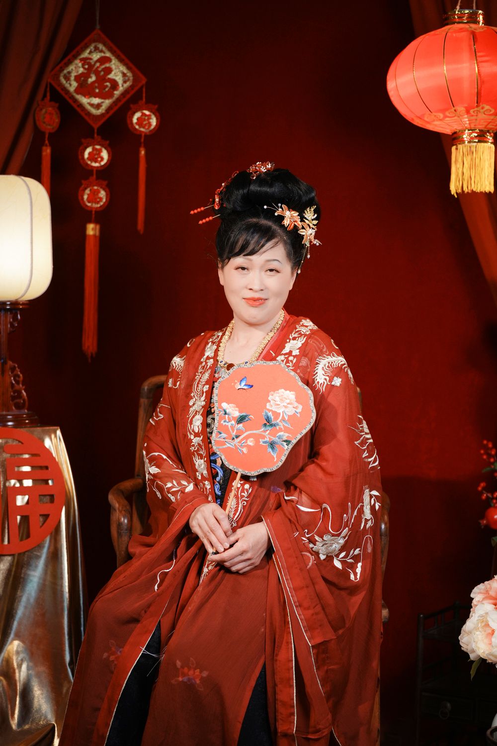 Cinematic warm-toned Tang Dynasty Hanfu portrait of a 3-generation family celebrating Lunar New Year, by Imagine Image Studio Auckland.