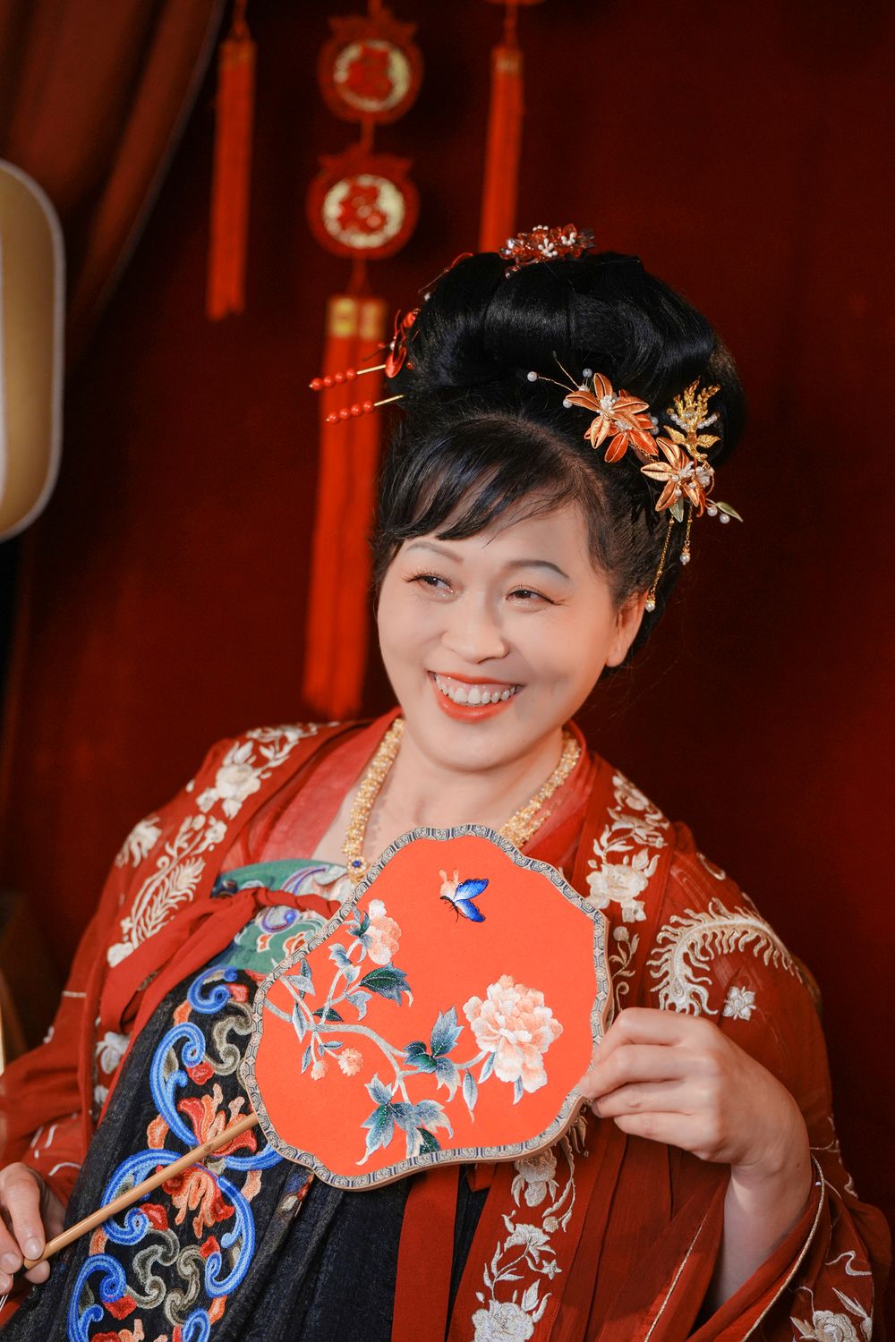 Cinematic warm-toned Tang Dynasty Hanfu portrait of a 3-generation family celebrating Lunar New Year, by Imagine Image Studio Auckland.