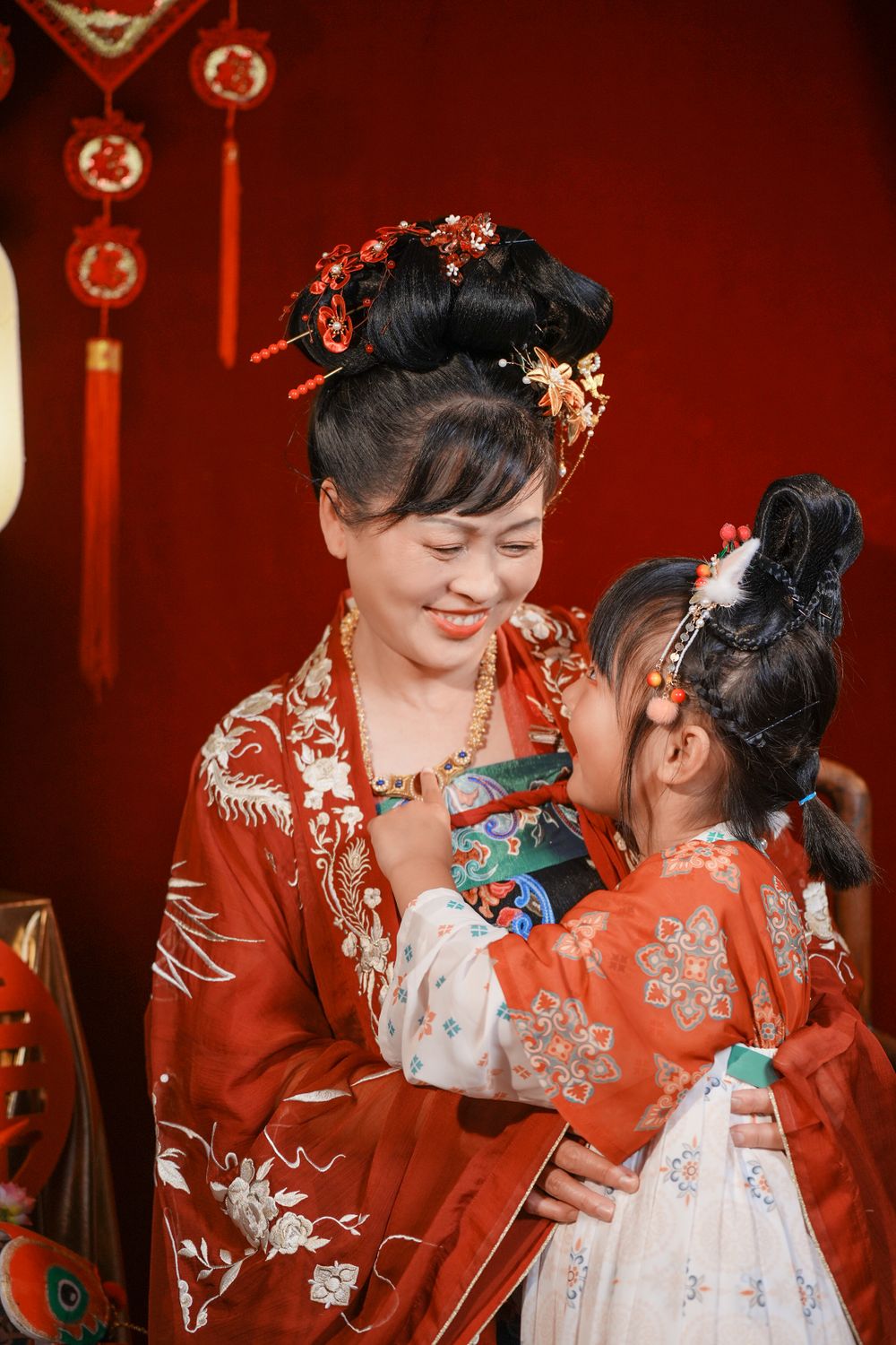 Warm cinematic 3-generation Tang Dynasty Hanfu family portrait for Chinese New Year, captured by Imagine Image Studio Auckland.