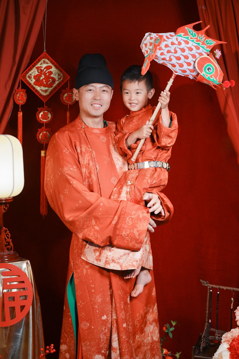 Warm cinematic 3-generation Tang Dynasty Hanfu family portrait for Chinese New Year, captured by Imagine Image Studio Auckland.