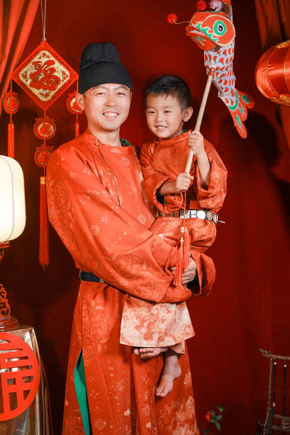 Warm cinematic 3-generation Tang Dynasty Hanfu family portrait for Chinese New Year, captured by Imagine Image Studio Auckland.