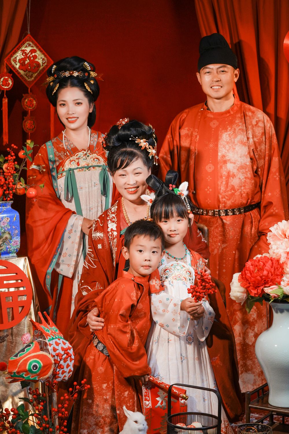 Warm cinematic 3-generation Tang Dynasty Hanfu family portrait for Chinese New Year, captured by Imagine Image Studio Auckland.