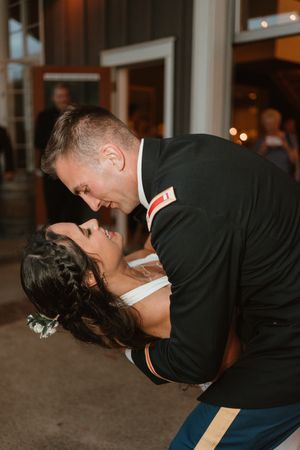 A sequence of romantic kisses shared between a couple at a wedding reception.