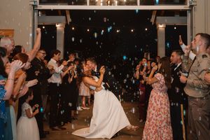 Wedding reception dance floor filled with guests enjoying the celebration.