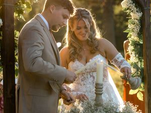 Bride and groom share intimate moments during golden hour wedding ceremony in lush garden setting.