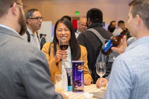 Networking event with food and drinks at business conference.