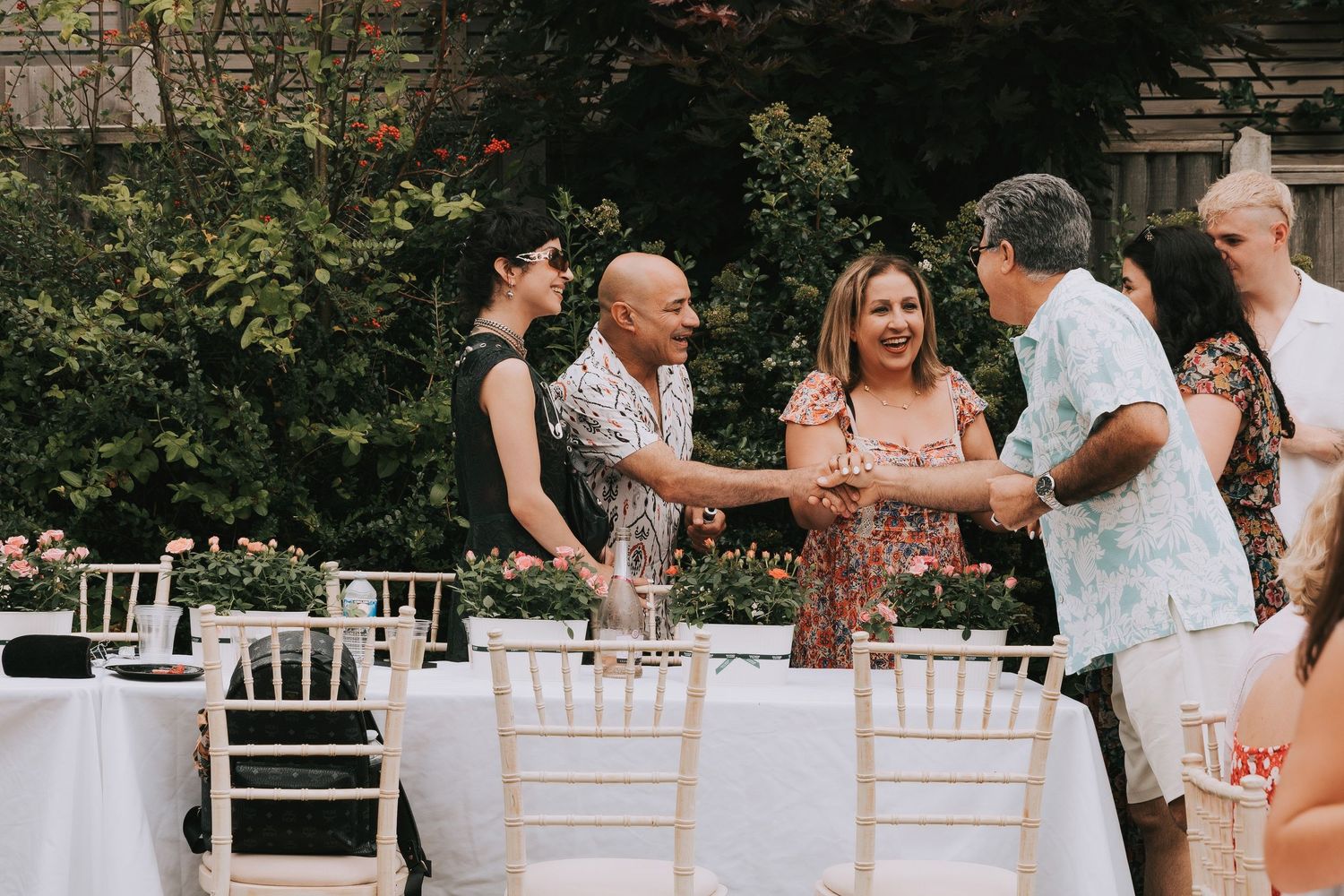 Guests welcoming each other at an outdoor birthday event enjoying the party vibes