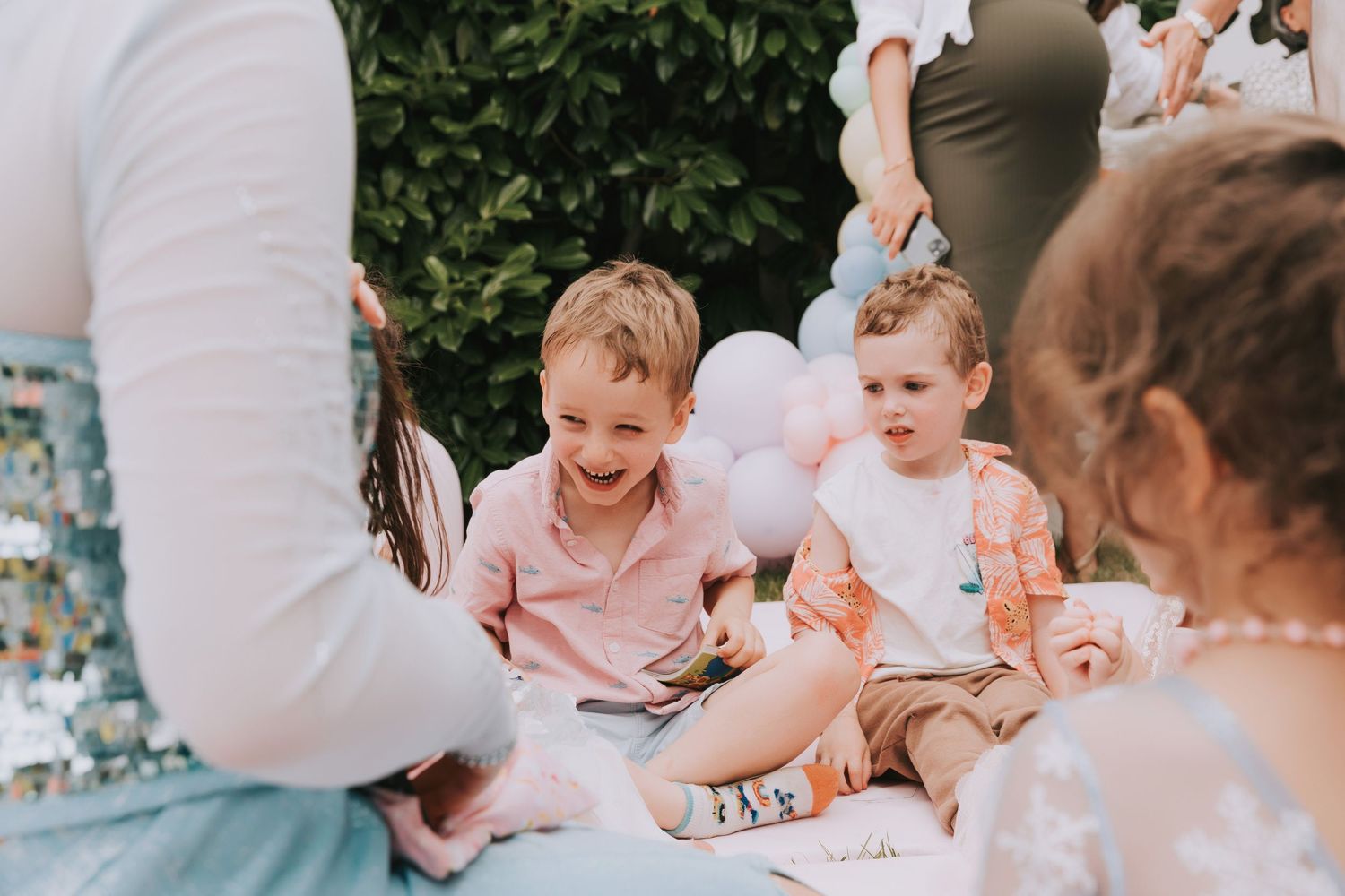 Child enthusiastically smiling at birthday party enjoying the activities