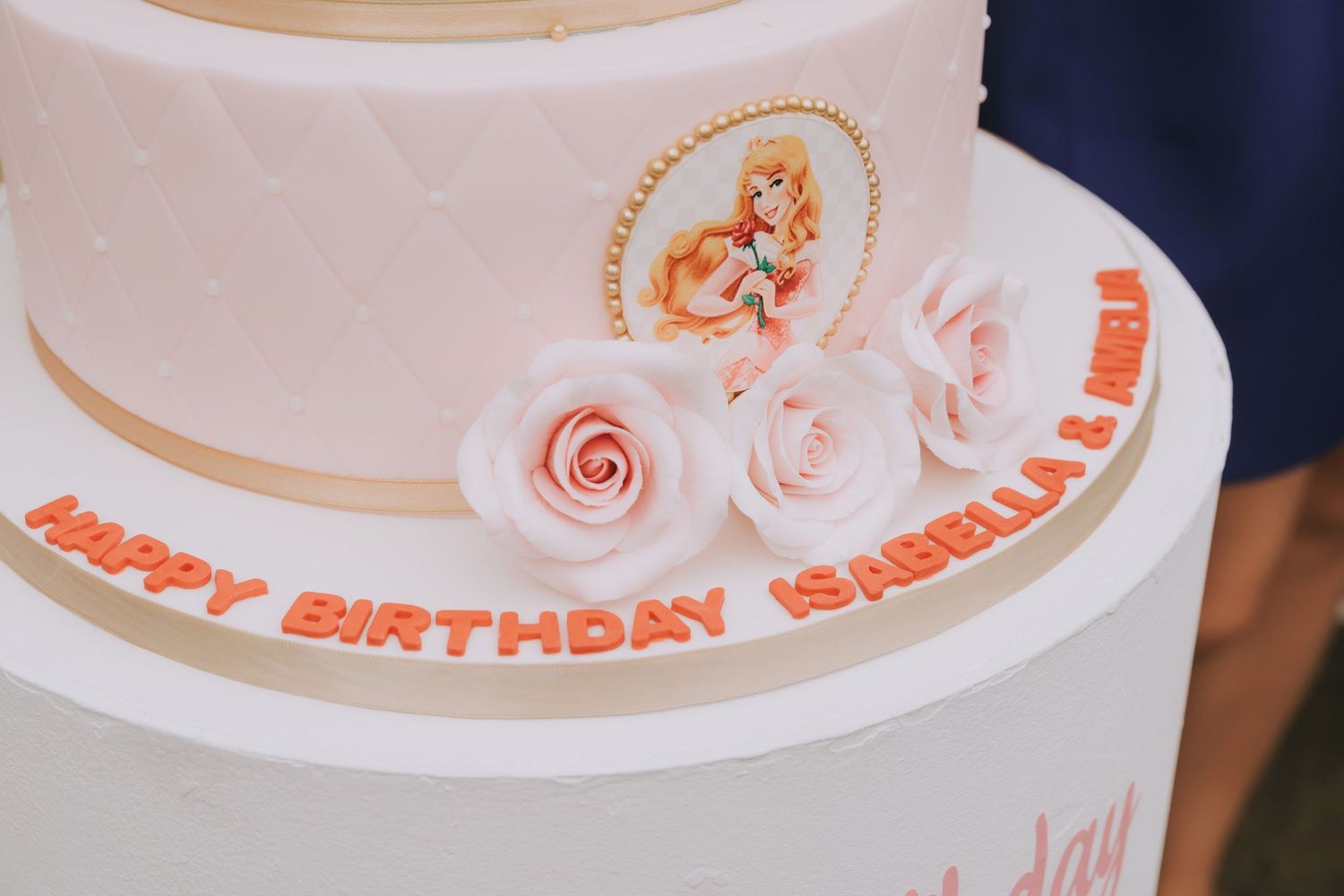 details of 3 tier decorated Disney princess cake