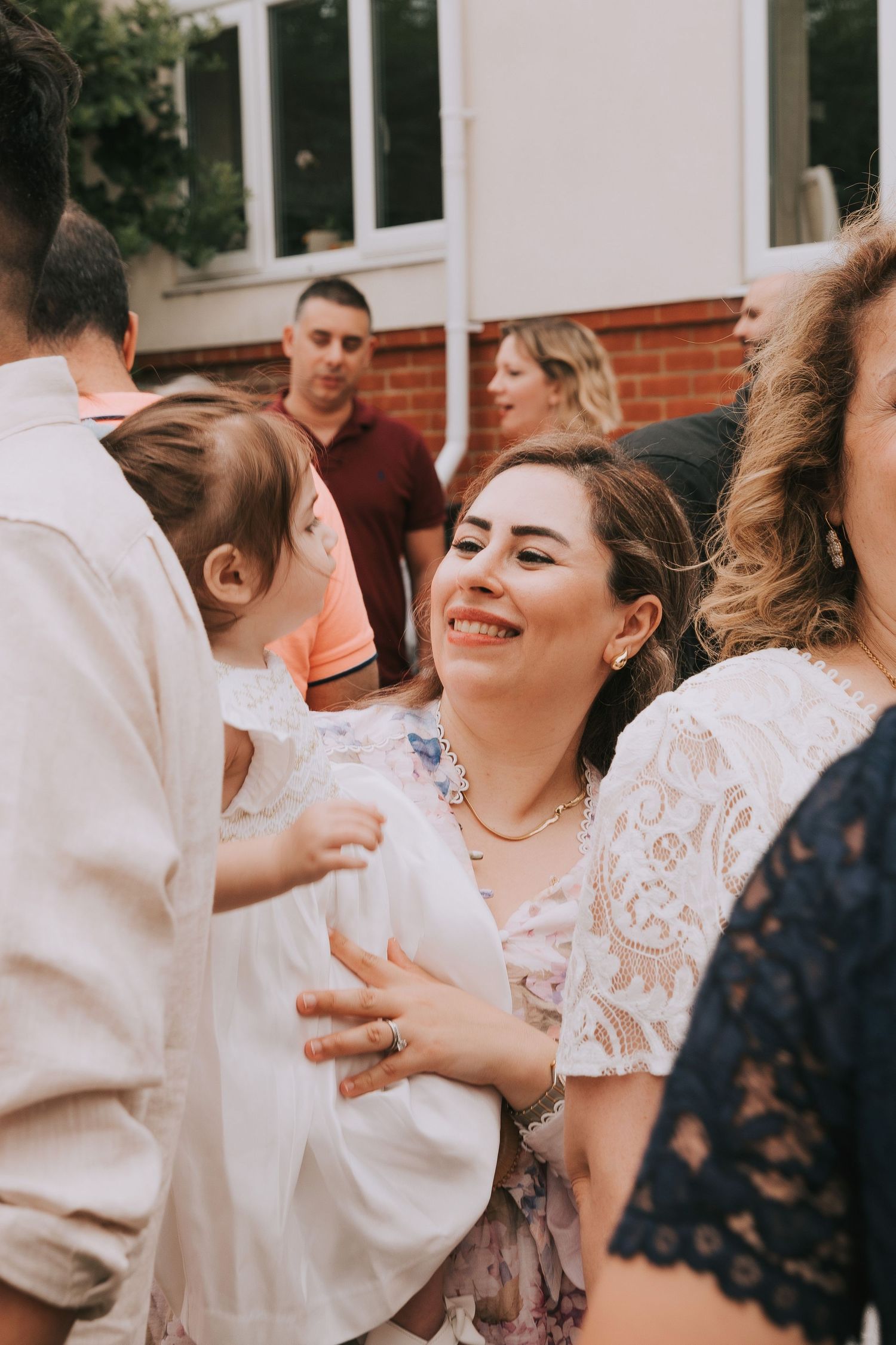 Mother and child at a birthday party dancing and smiling