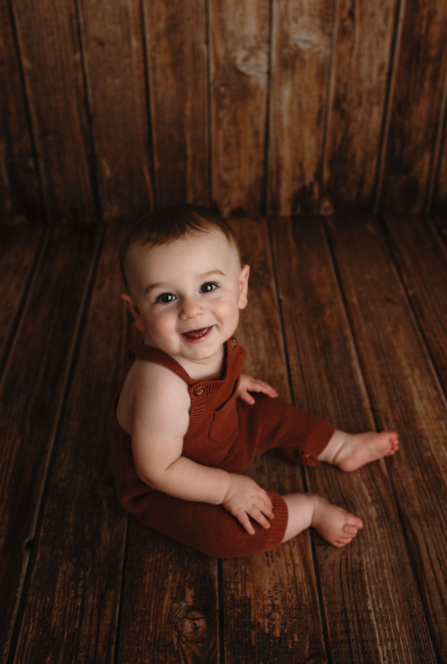 Harrisonburg photographer, baby, milestone, family, newborn, maternity, baby boy on wood floor in orange romper