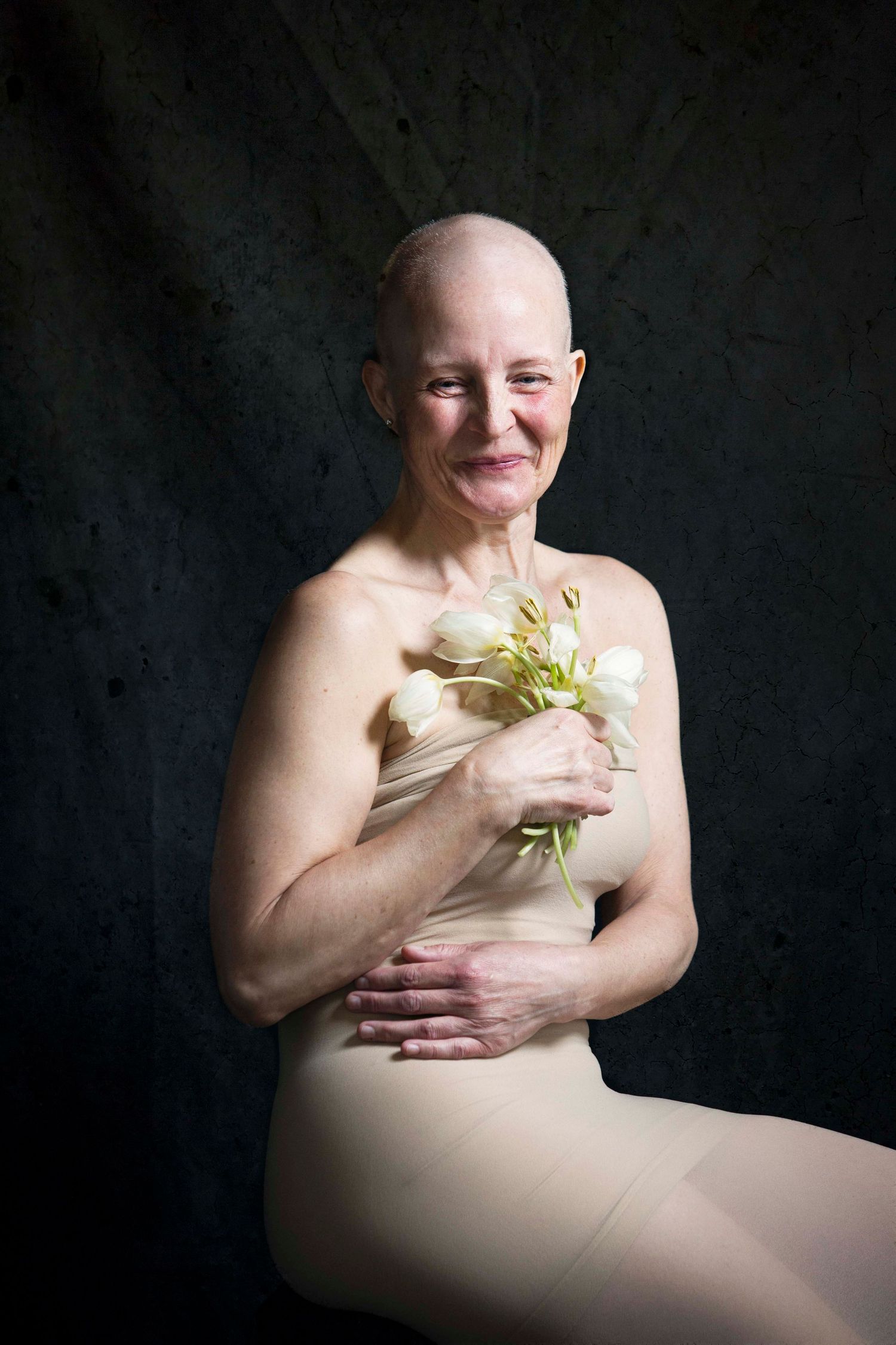 Chemotheraphy, tulips, flowers, bald woman, caucasian, smiling, cancer, healing