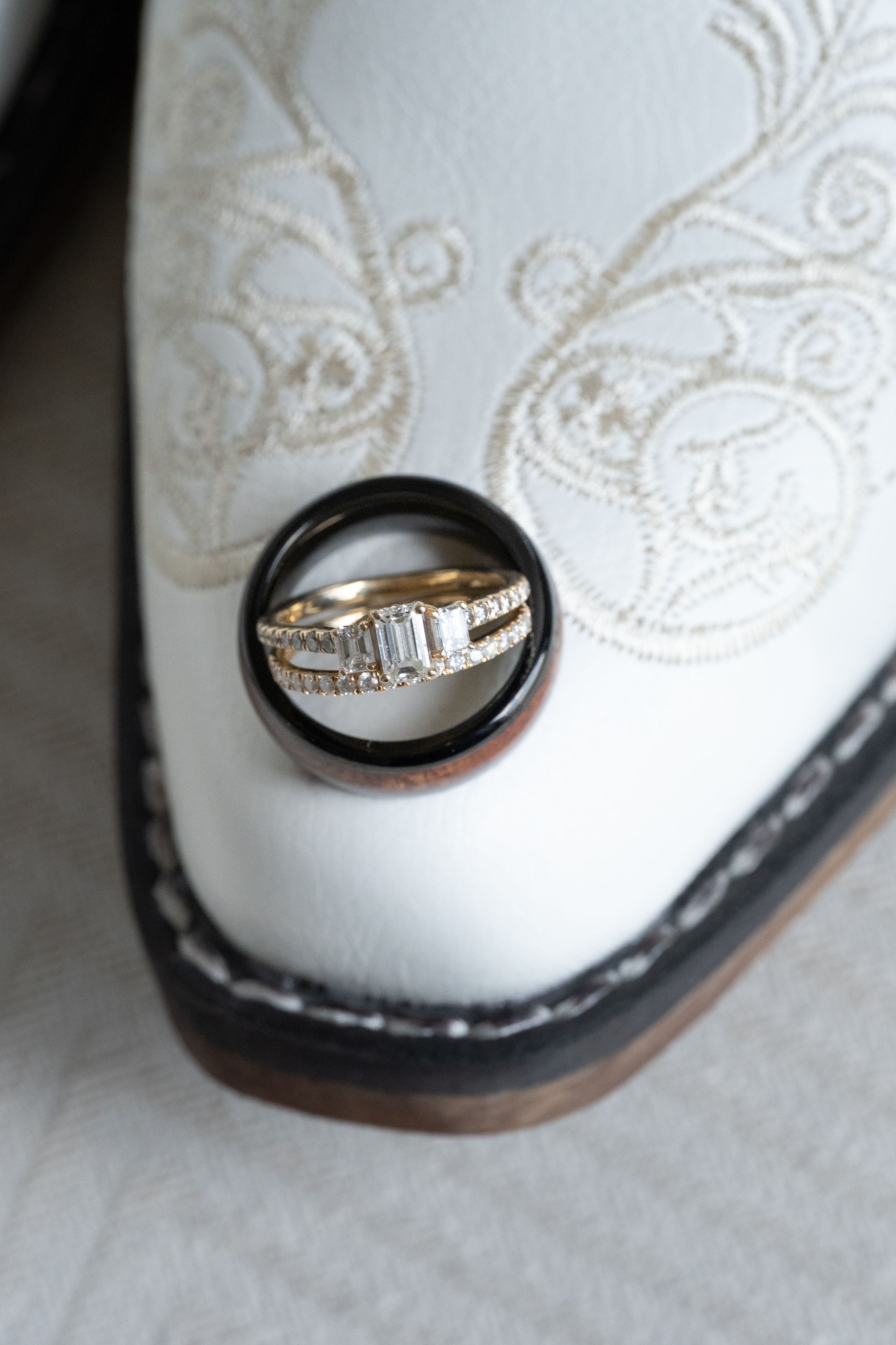 Close-up photo series showing a wedding band from multiple angles with gold detailing and diamond accents.