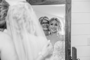 A collection of black and white wedding photos displayed in a grid layout shows candid moments and celebrations.