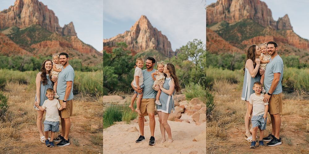 Family of four posing together in Zion National Park with red rock mountains and desert landscape backdrop.
