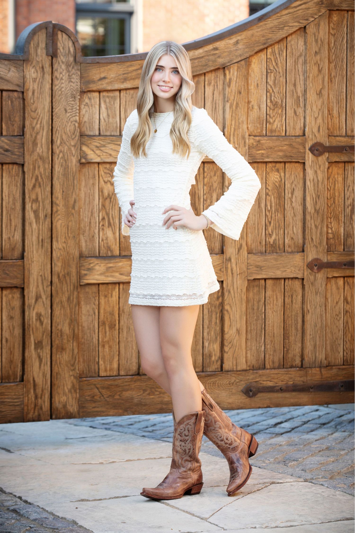 Worthington Kilbourne senior pictures in German Village with rustic wood doors, western style, and Columbus Ohio senior photography.