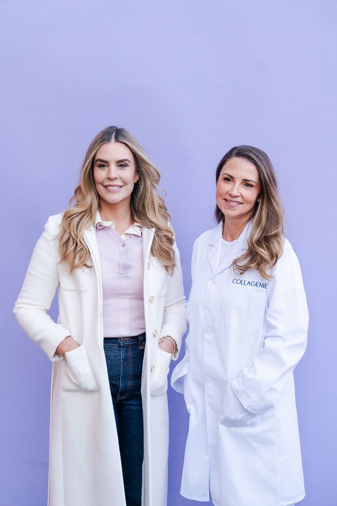 Two women in white coats smile against a purple background, one wearing a Collagenie lab coat.