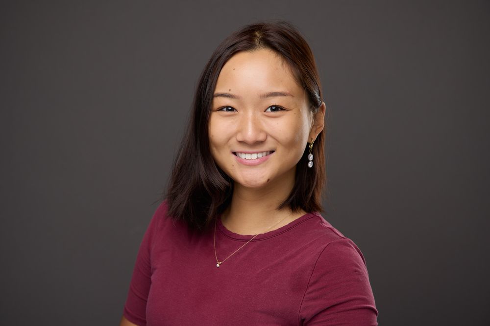 Professional headshots of a person in a burgundy sweater against a dark background.