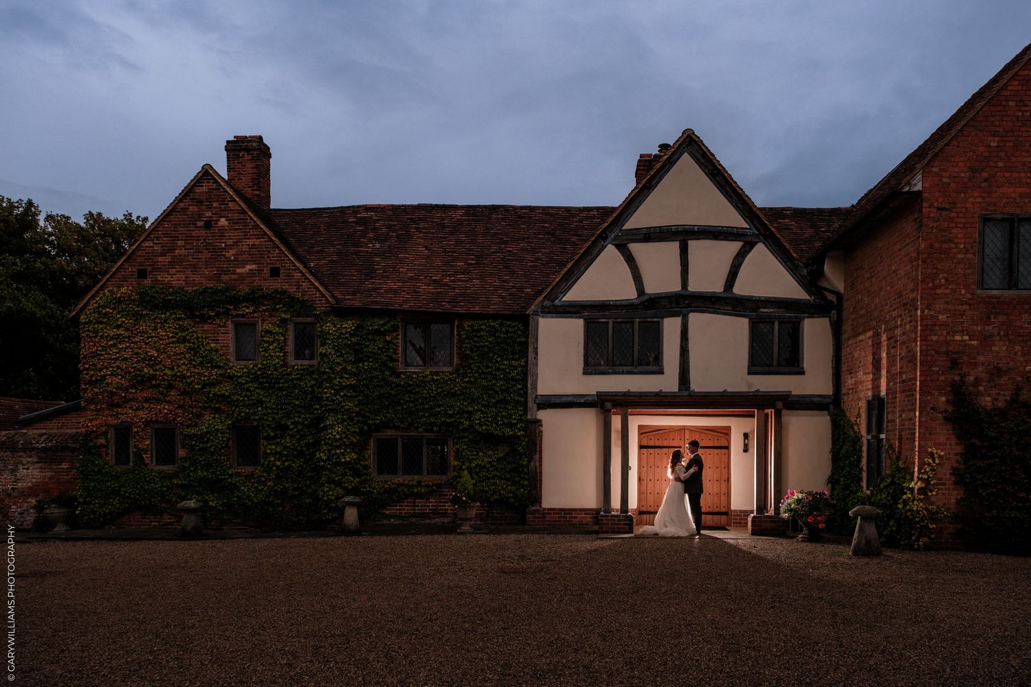 A series of black and white wedding photos showing a bride in a ballgown and guests at an elegant indoor reception.