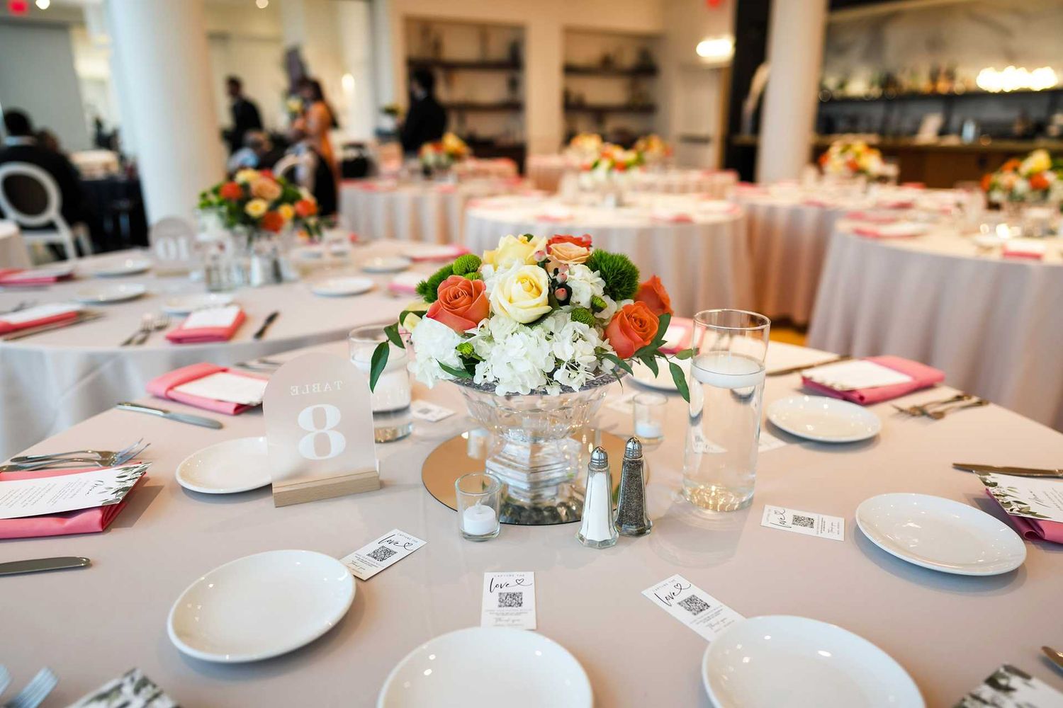 Elegant wedding reception tables with pink linens, at the view wedding venue
