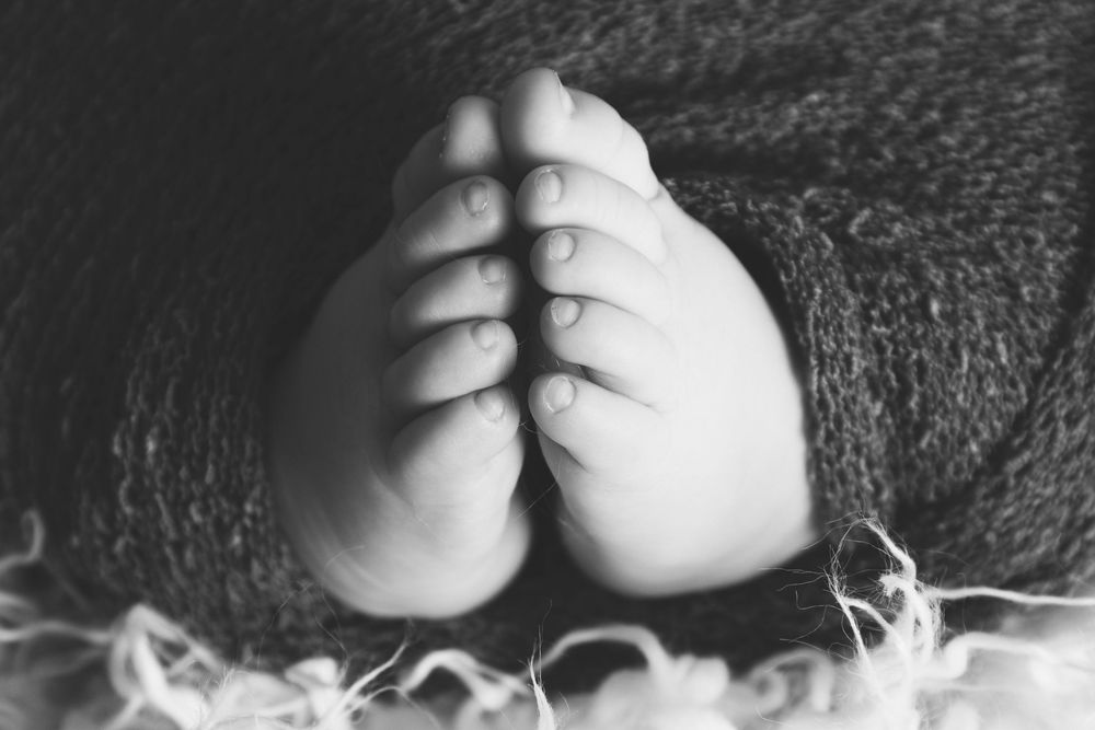 baby toes in s praying hand pose