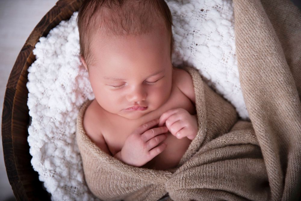 baby boy sleeping so calm and relaxed at his Gold Coast newborn session