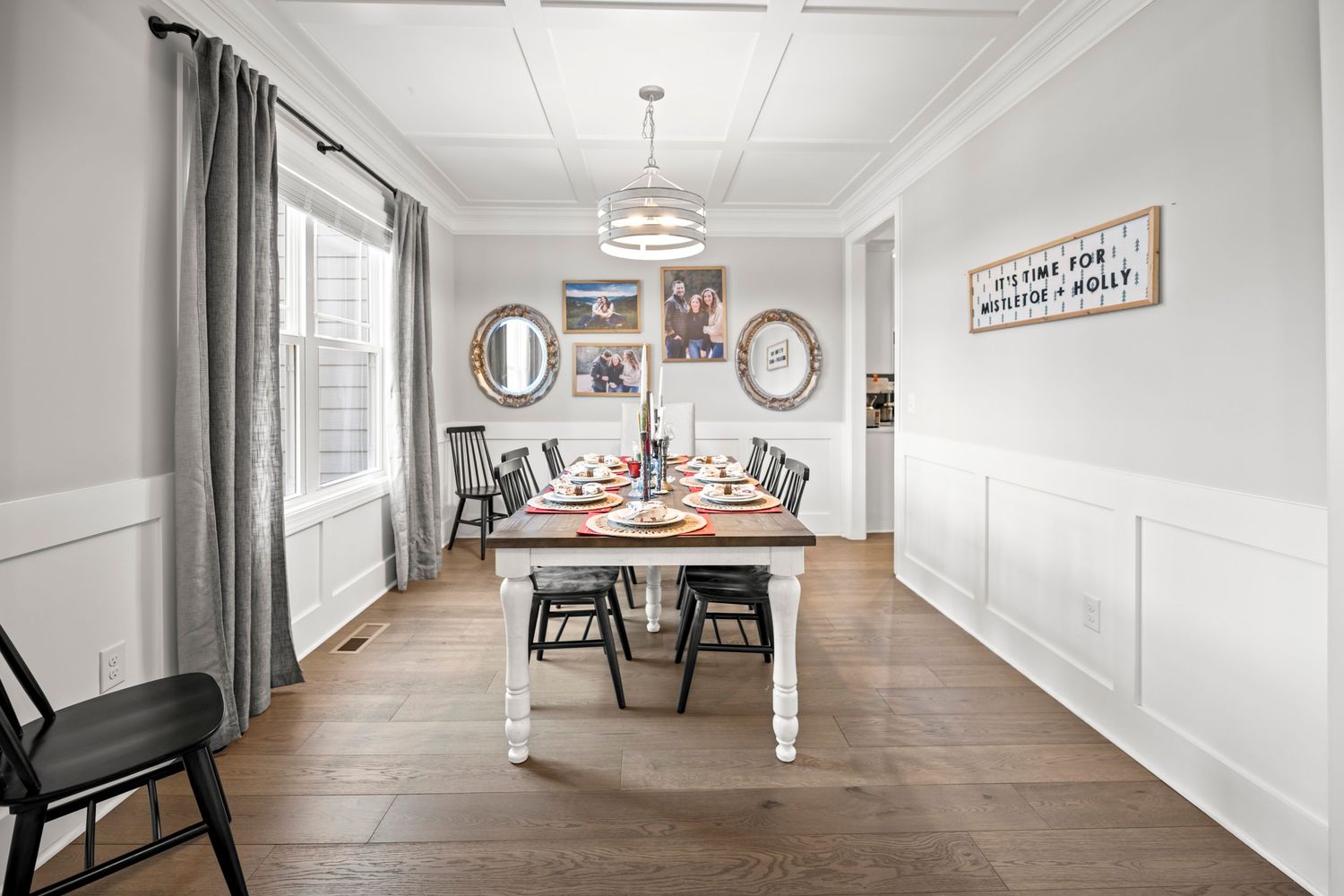 Bright dining room with hardwood floors photographed for a residential real estate listing