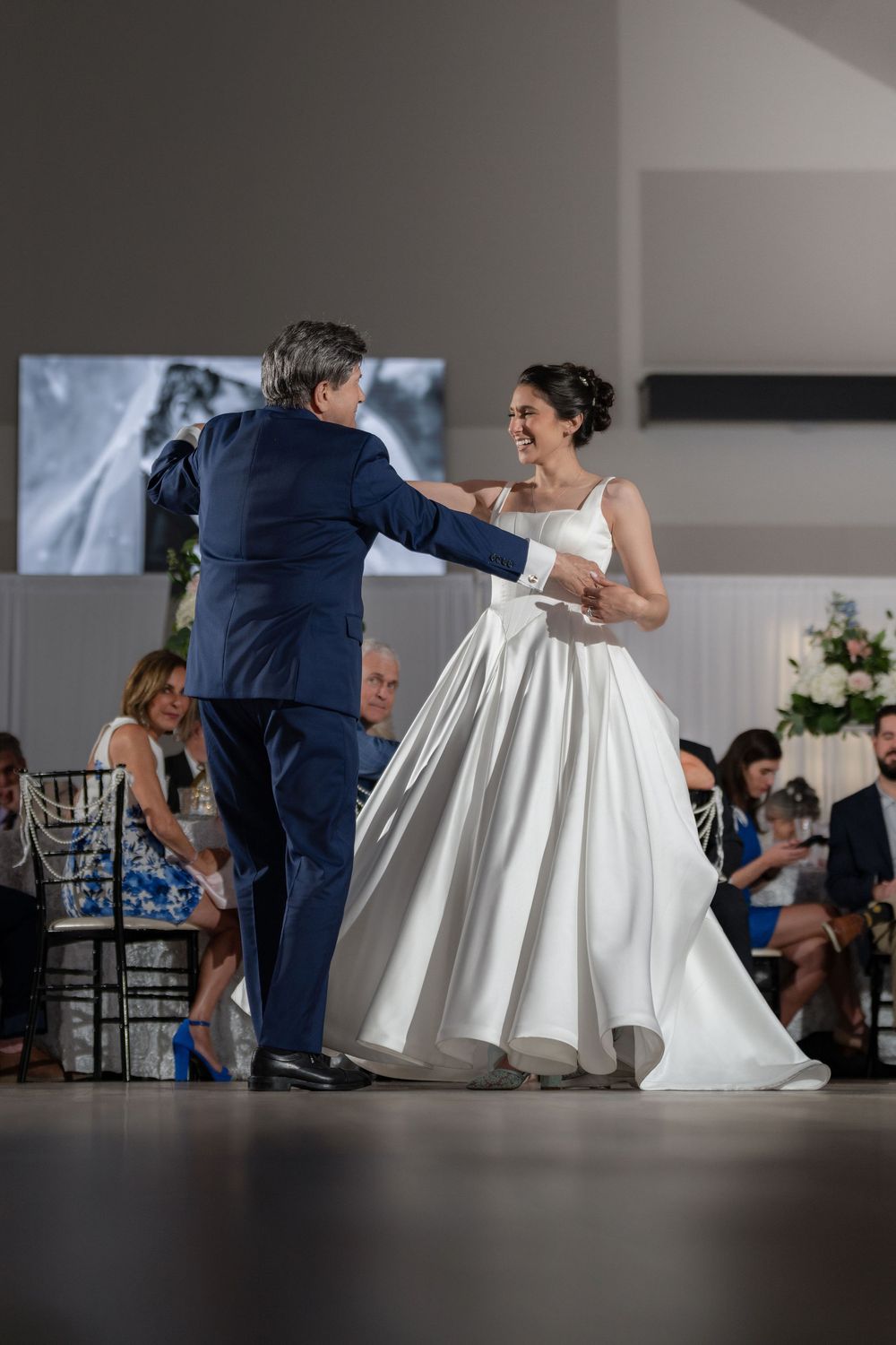 Bride mid-twirl during the father daughter dance at Tradition Town Hall in Tradition, FL