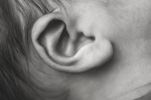 Close-up of a newborn baby’s ear captured during a newborn photography session.