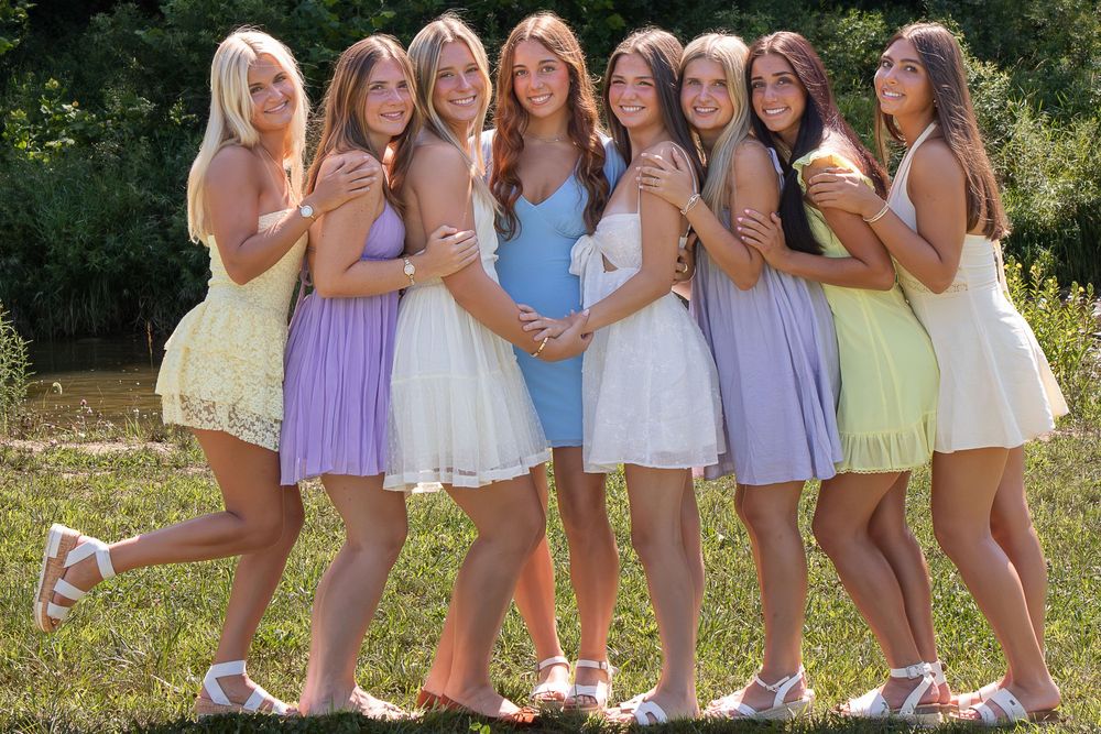 Best friends who are seniors smile together and take photos for their senior year in Strongsville.