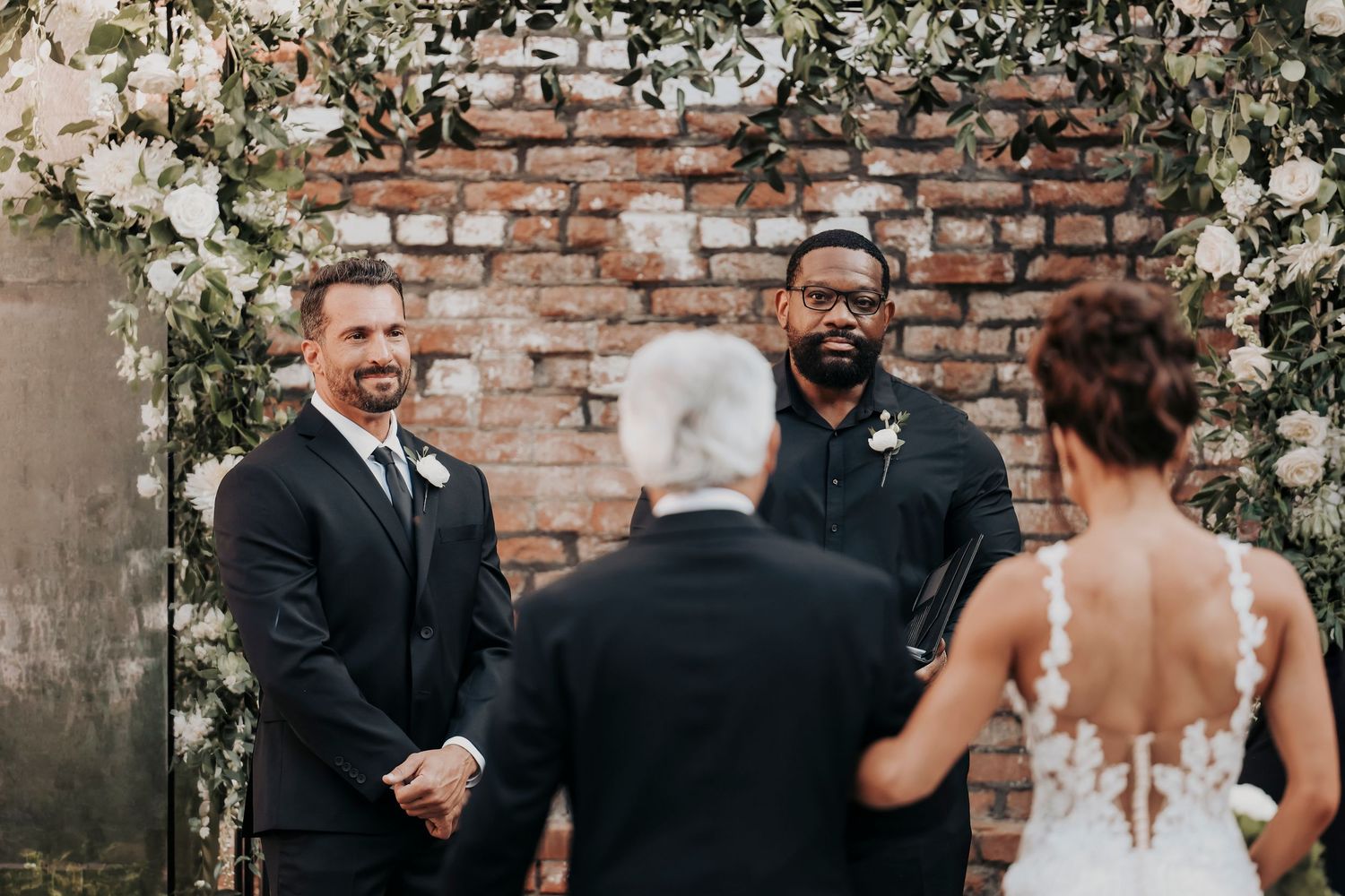 Joel watching Megan arrive at their McKinney wedding ceremony