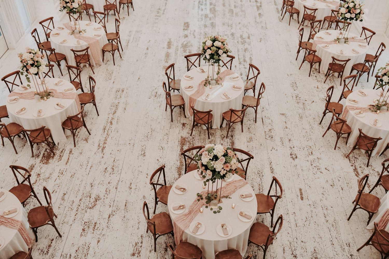 The White Sparrow reception space filled with natural light and romantic fall flowers