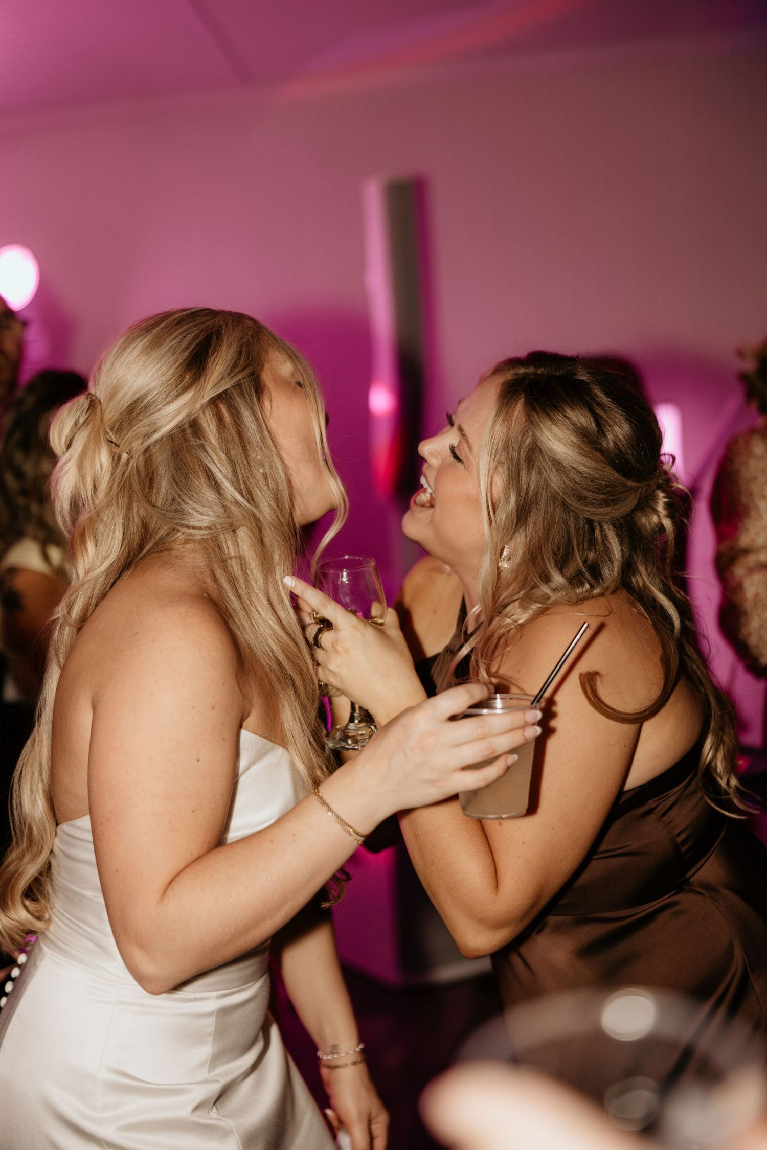 Bride dancing with guests during a winter wedding reception.