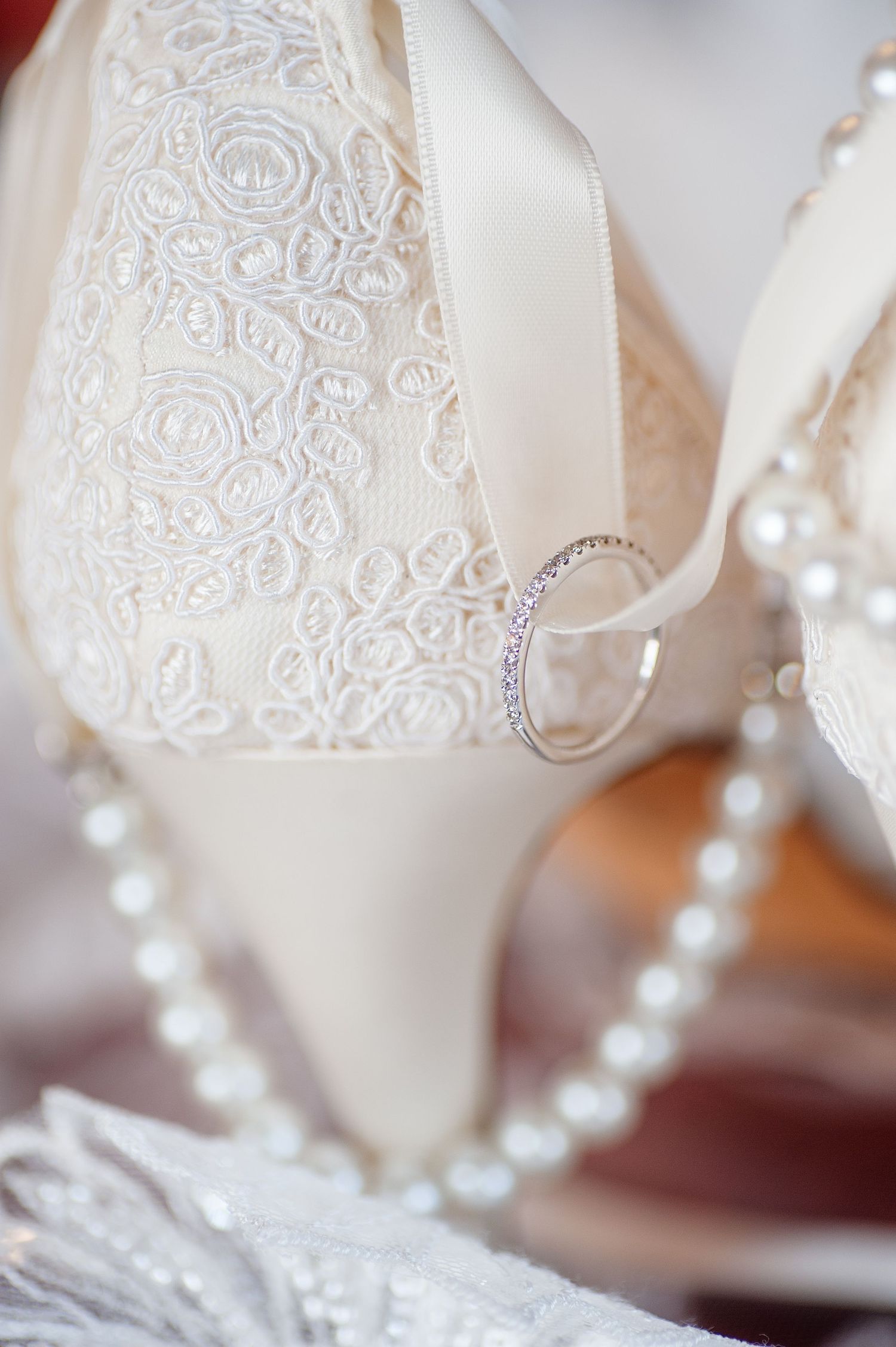 Detail photog of ring and shoes