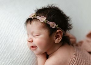 Side profile of a newborn smiling. Greenville, SC newborn photographer, Easley, SC Newborn photographer