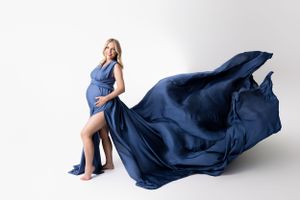 Maternity session, high key white, with a demim diadora flying dress by mii estilo, captured by cedar park maternity photographer