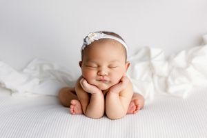 Newborn baby girl in cedar park texas, posed in Froggy during baby photo session
