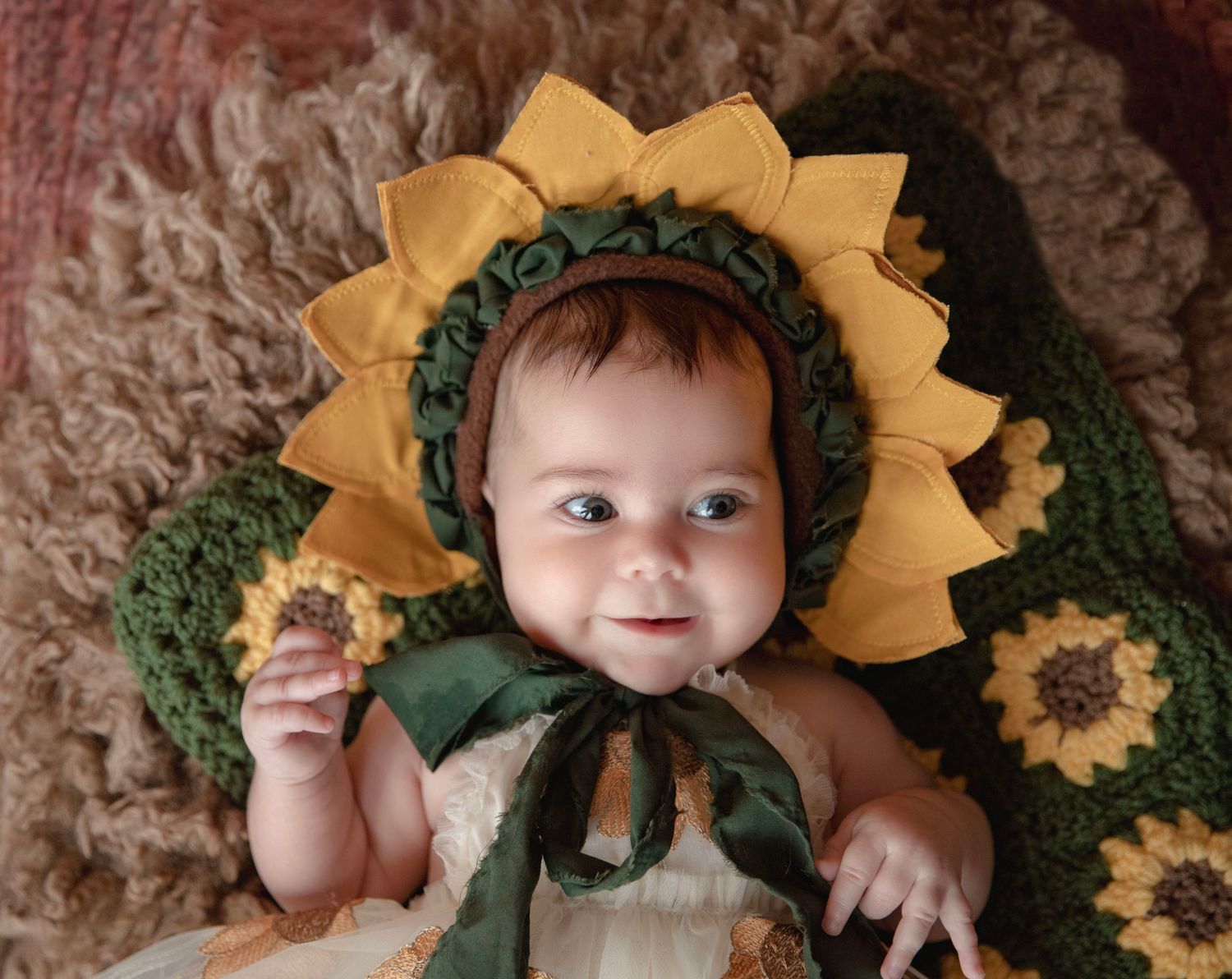Baby milestone photography session in Central Florida with baby in sunflower outfit.