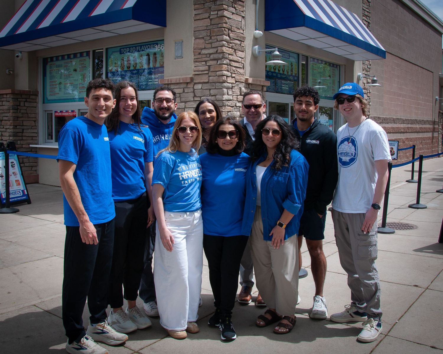 Multi generational family in front of an ice cream store