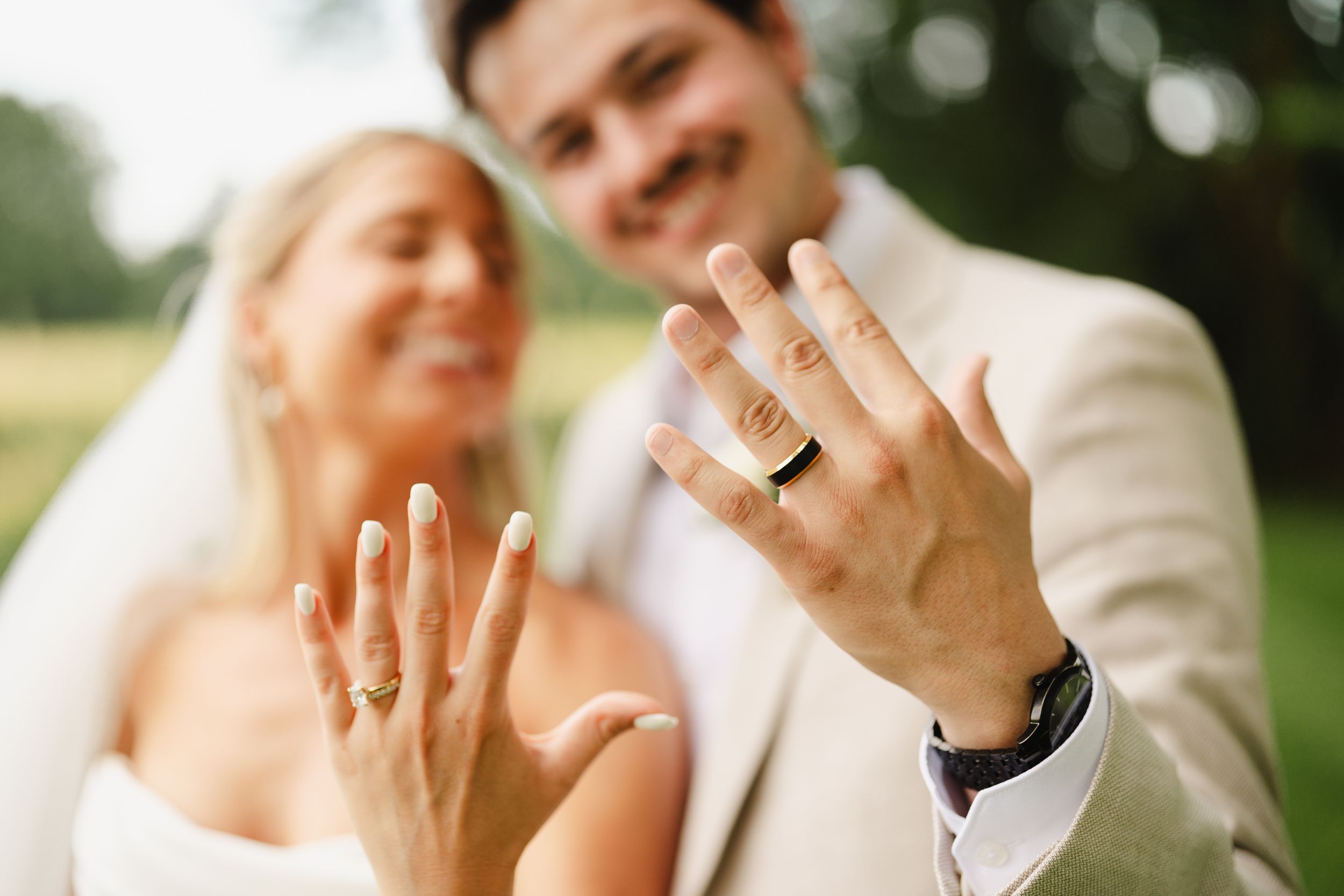 Candid wedding couple moments shared during outdoor photo session.
