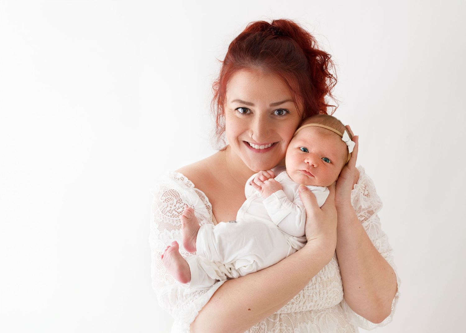 mother wears beautiful, timeless dress as she shows off her new baby girl